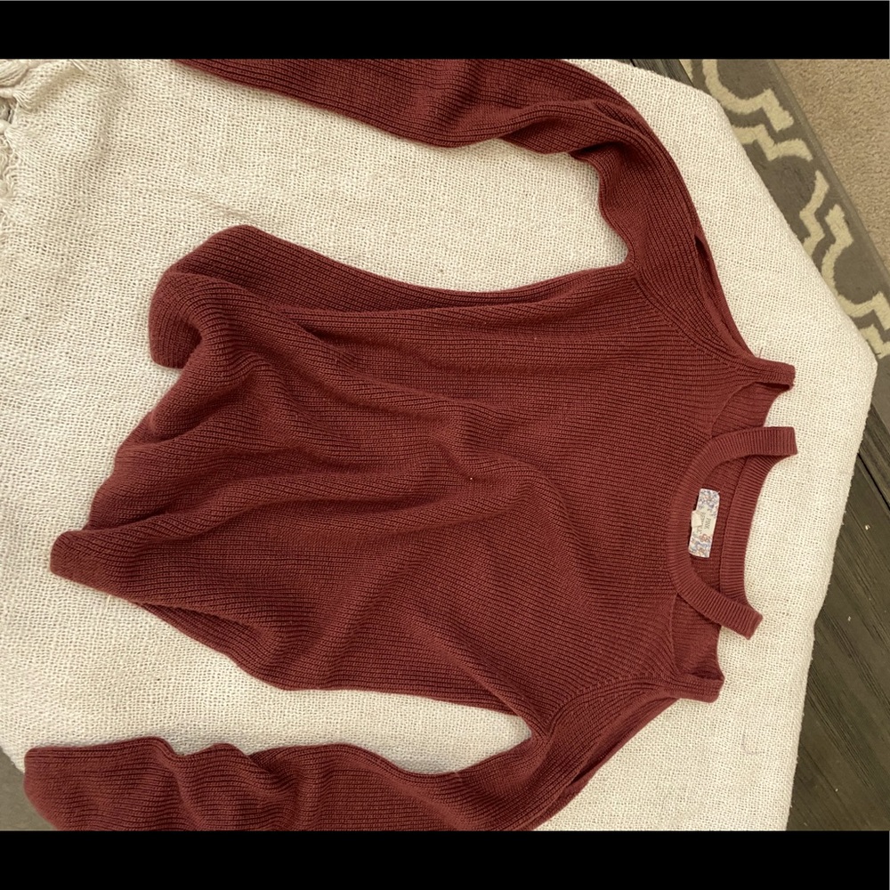 Shoulder showing light weight sweater
